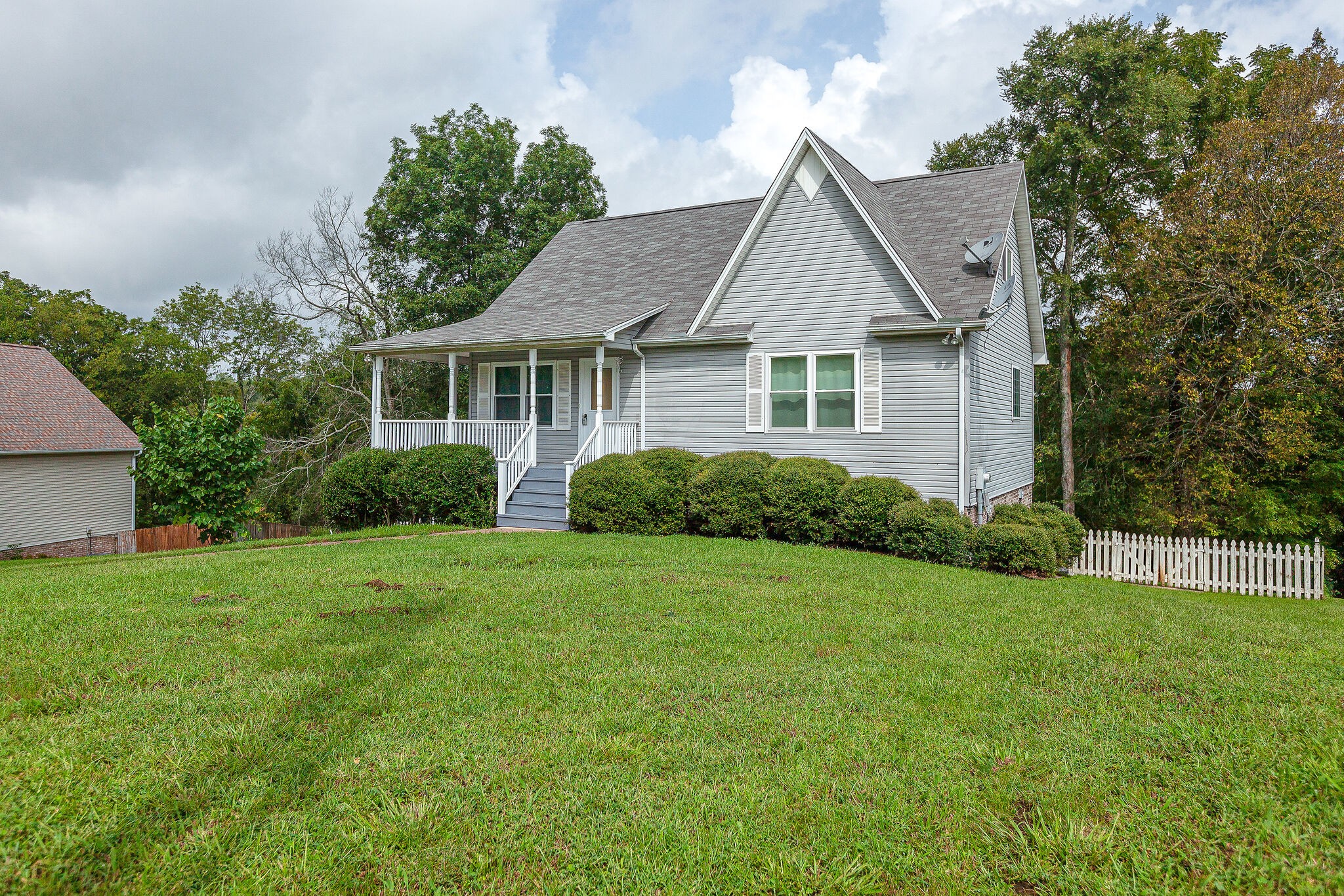 3668 Rutherford Drive Spring Hill, TN 37174 - Photo 3 of 31 a front view of a house with a yard and trees