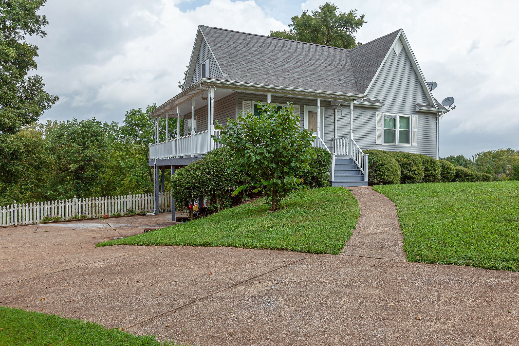 3668 Rutherford Drive Spring Hill, TN 37174 - Photo 4 of 31 a front view of a house with a yard and garage