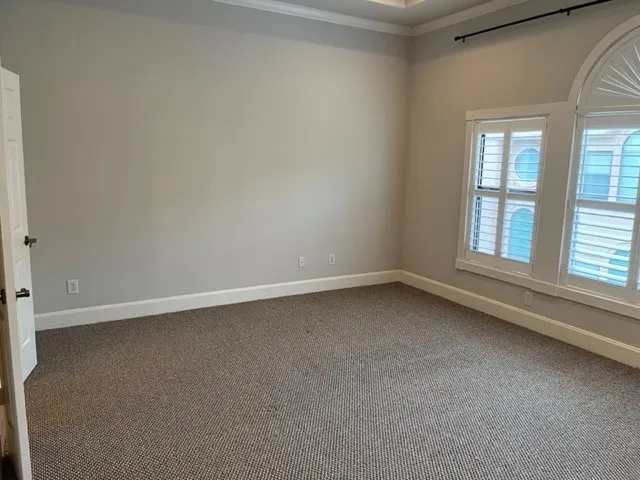 a spacious bathroom with a shower and a sink