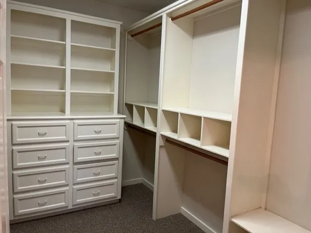 a view of an empty walk in closet