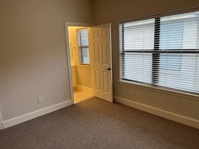 an empty room with closet area