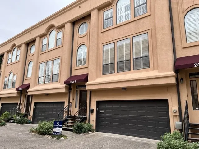 a view of a house with entrance gate