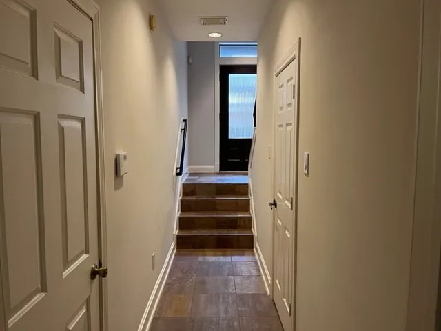 a kitchen with stainless steel appliances granite countertop a refrigerator and a stove