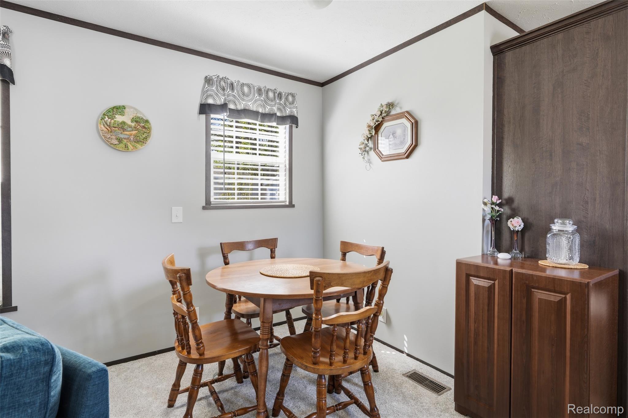 440 Flamingo Street Rochester, MI 48309 - Photo 13 of 32 Dining room featuring crown molding and light colored carpet