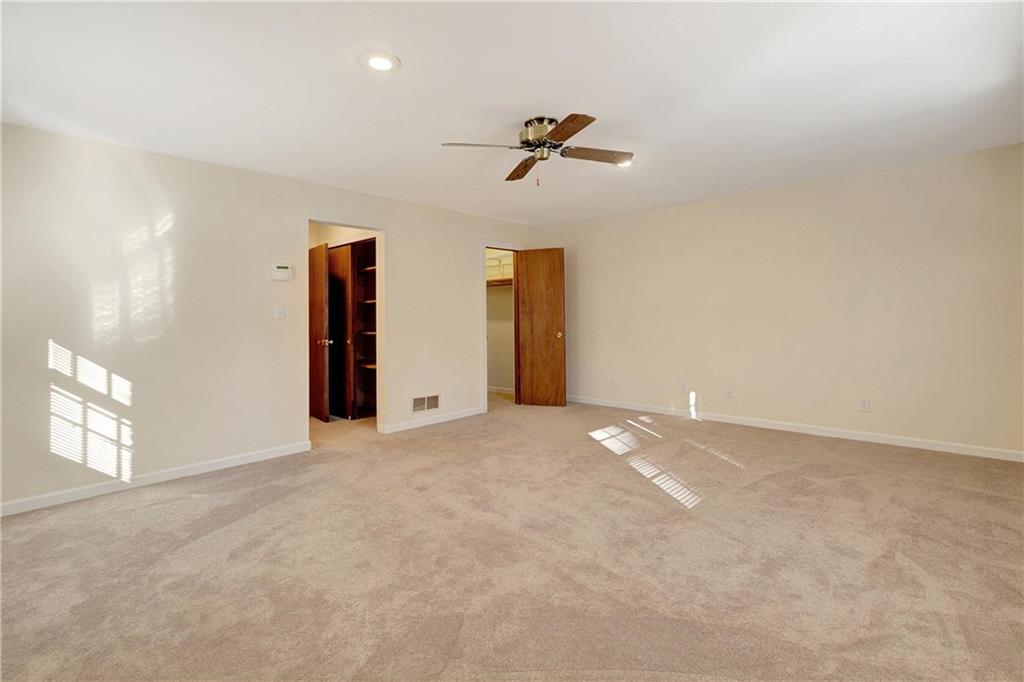 10185 Henry Mill Road Chattahoochee Hills, GA 30213 - Photo 12 of 41 a view of a livingroom with a ceiling fan and window