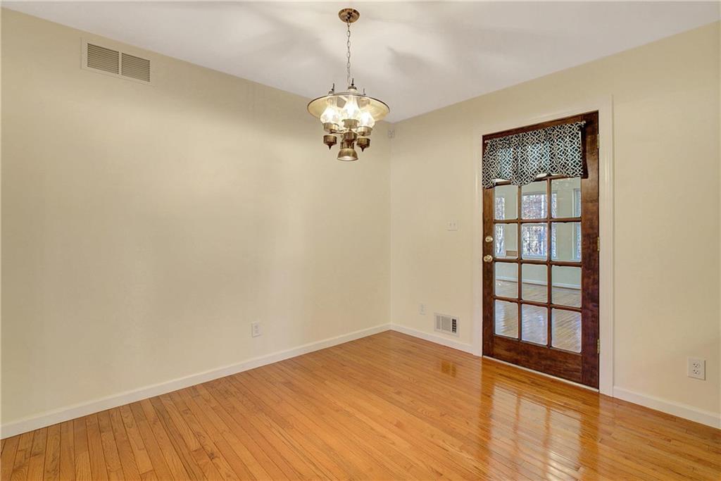 10185 Henry Mill Road Chattahoochee Hills, GA 30213 - Photo 19 of 41 a view of wooden floor in an empty room with a window