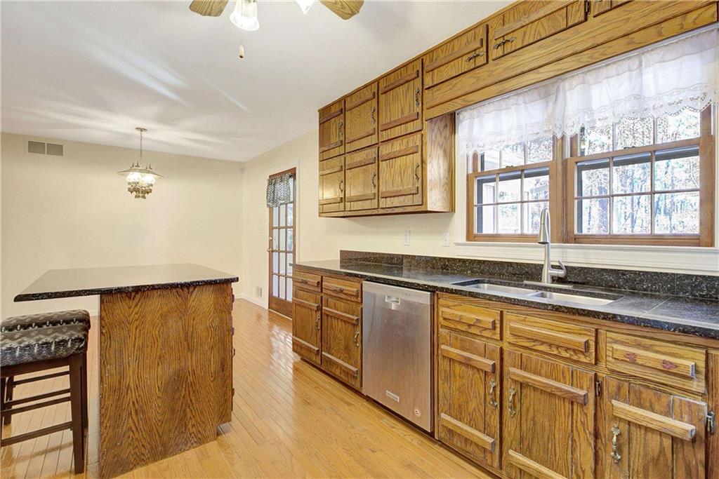 10185 Henry Mill Road Chattahoochee Hills, GA 30213 - Photo 22 of 41 a view of a large oven a sink and a dishwasher