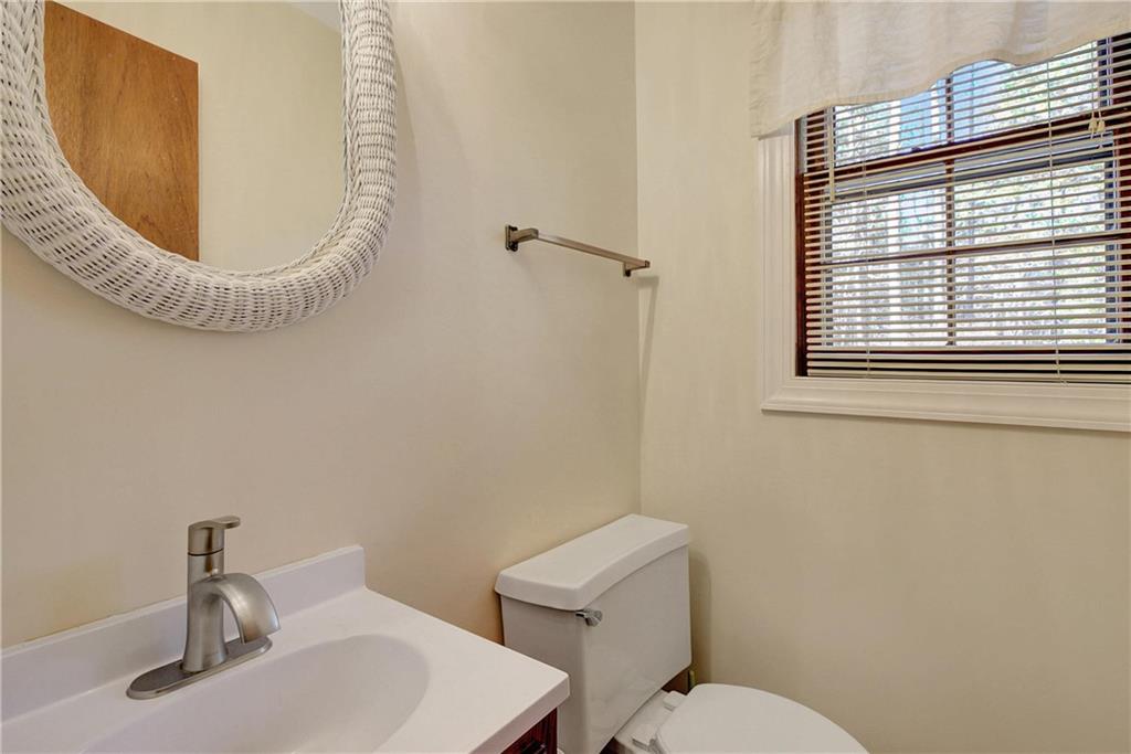 10185 Henry Mill Road Chattahoochee Hills, GA 30213 - Photo 24 of 41 a bathroom with a toilet and a sink