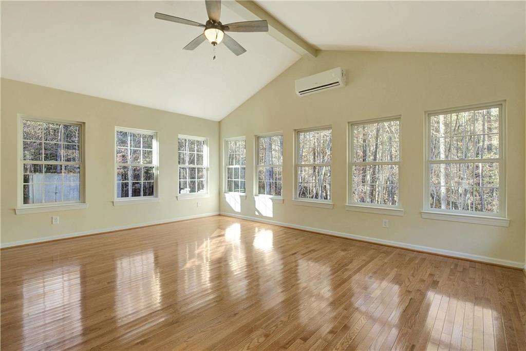 10185 Henry Mill Road Chattahoochee Hills, GA 30213 - Photo 25 of 41 a view of an empty room with a window and wooden floor