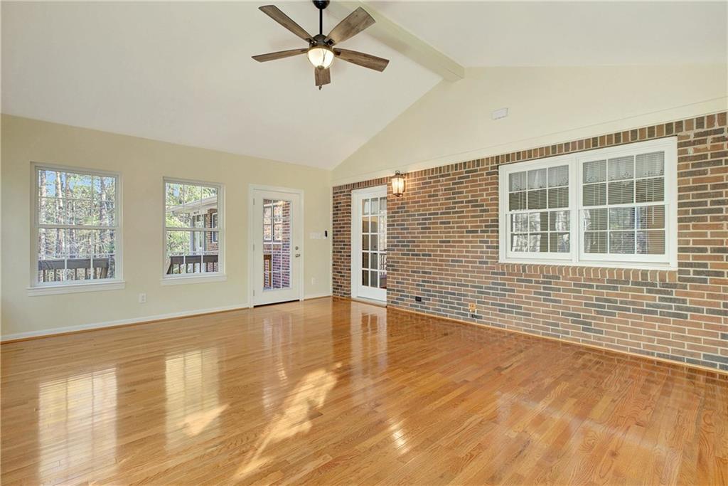 10185 Henry Mill Road Chattahoochee Hills, GA 30213 - Photo 26 of 41 a view of an empty room with a window and wooden floor