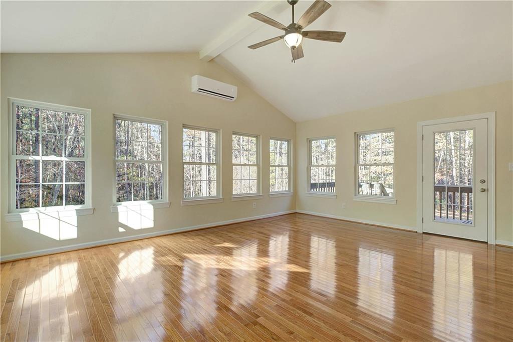 10185 Henry Mill Road Chattahoochee Hills, GA 30213 - Photo 27 of 41 a view of an empty room with wooden floor and a window