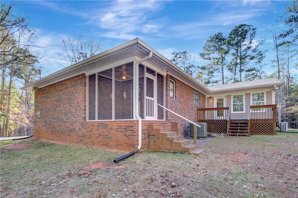 10185 Henry Mill Road Chattahoochee Hills, GA 30213 - Photo 30 of 41 front view of a house with a yard