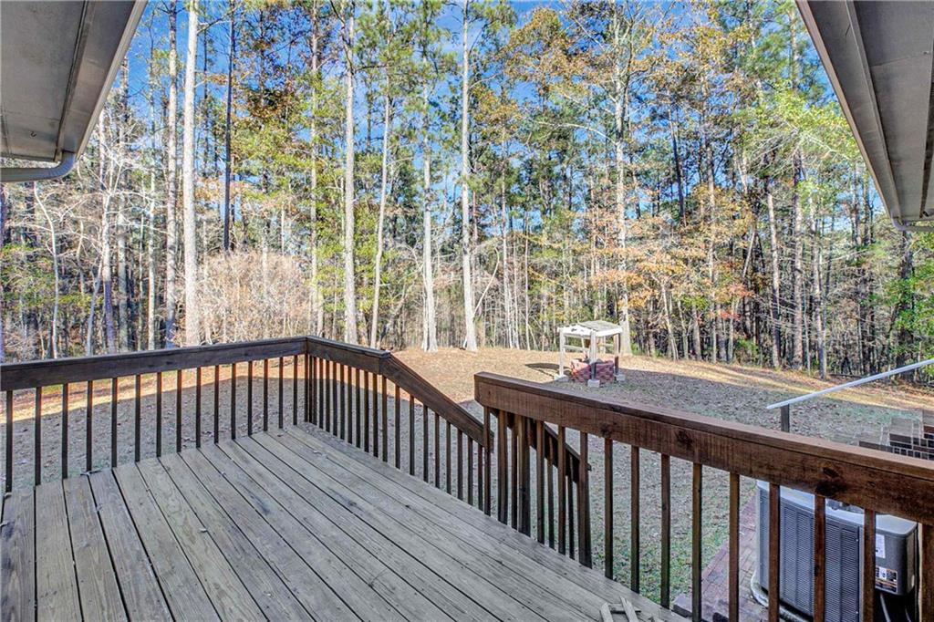 10185 Henry Mill Road Chattahoochee Hills, GA 30213 - Photo 33 of 41 a view of a balcony with wooden floor and fence