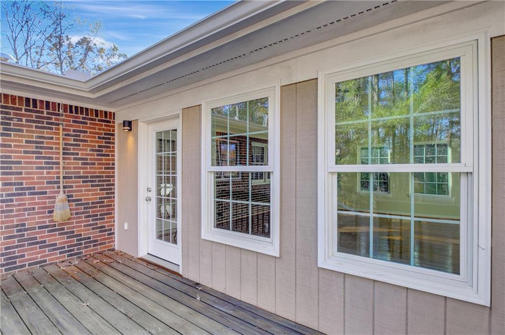 10185 Henry Mill Road Chattahoochee Hills, GA 30213 - Photo 34 of 41 a view of front door of house with deck