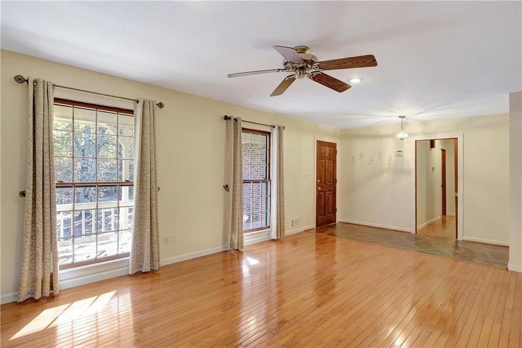 10185 Henry Mill Road Chattahoochee Hills, GA 30213 - Photo 5 of 41 a view of an empty room with wooden floor and a window