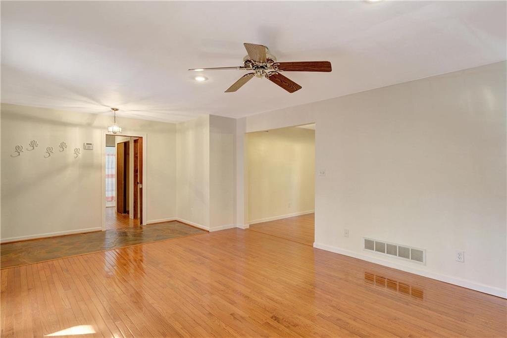 10185 Henry Mill Road Chattahoochee Hills, GA 30213 - Photo 6 of 41 a view of empty room with wooden floor