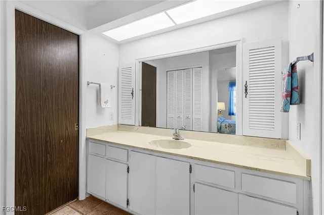 a bathroom with a sink and a mirror