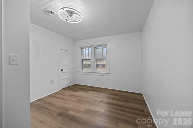 a view of a room with rack and window