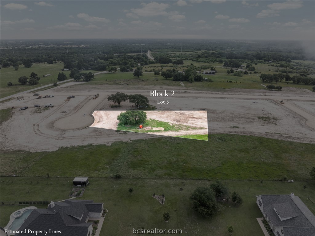 5076 Mesquite Ridge Bryan, TX 77808 - Photo 2 of 16 an aerial view of a house with a yard