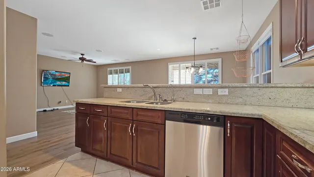 a kitchen with a sink and cabinets