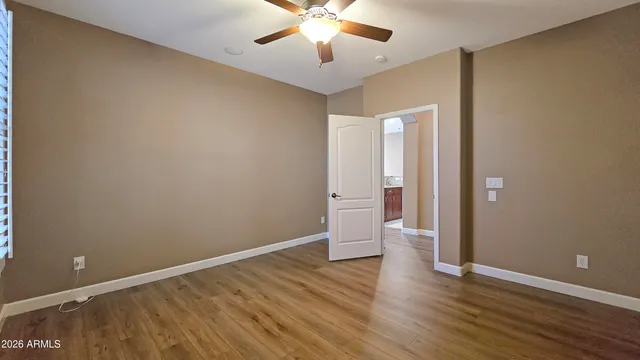 a view of an entryway with wooden floor and stairs