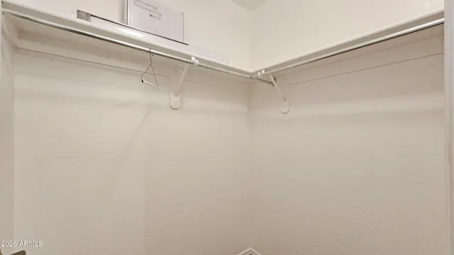 a room with a bed and window