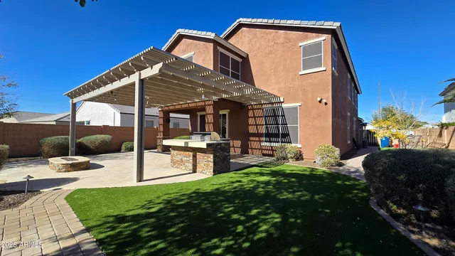 a view of a backyard with a patio