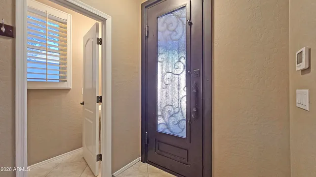 a view of front door with a mirror