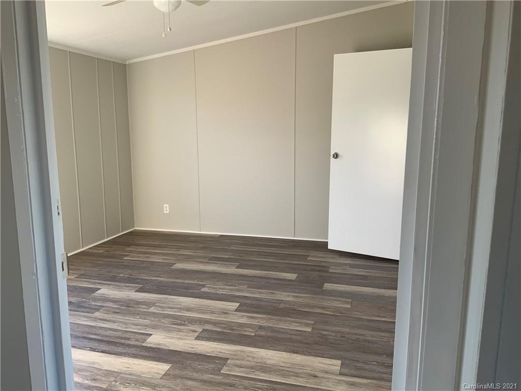 115 Riting Road, Unit 58 Salisbury, NC 28147 - Photo 16 of 23 a view of empty room with wooden floor