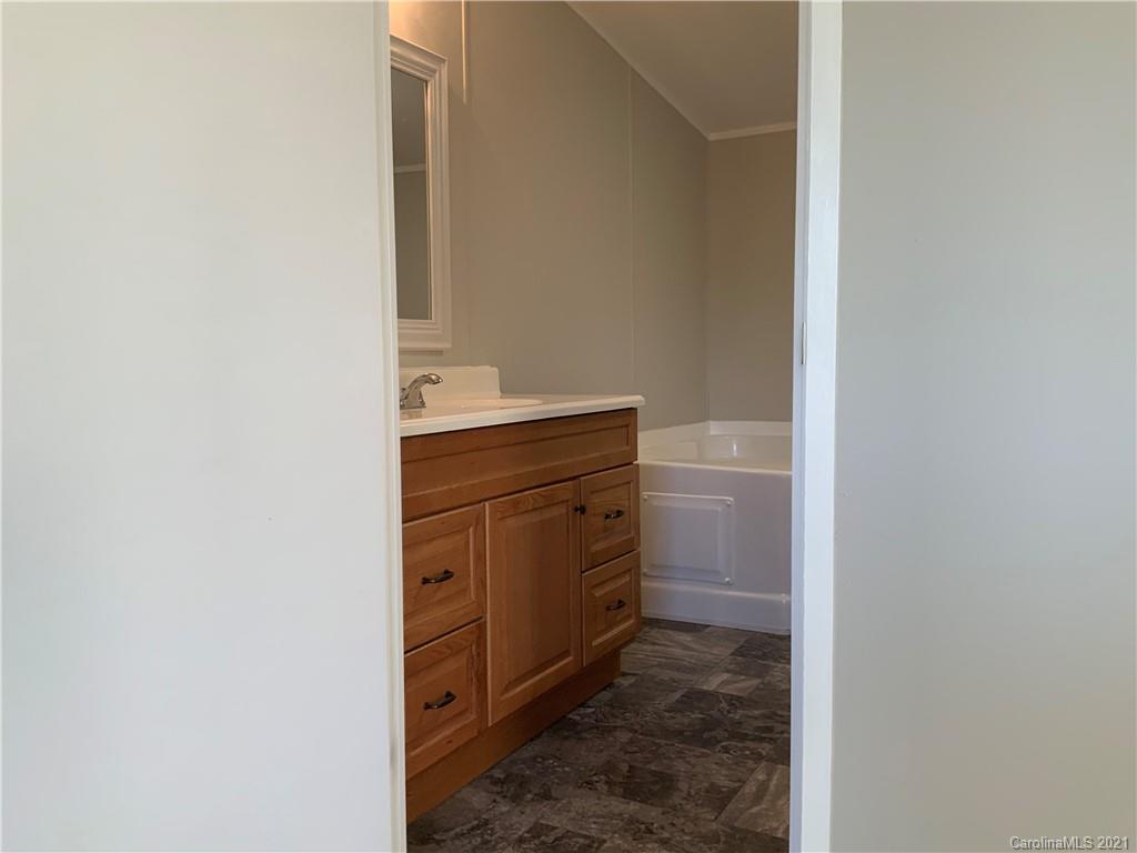 115 Riting Road, Unit 58 Salisbury, NC 28147 - Photo 17 of 23 a room with a cabinets and washer
