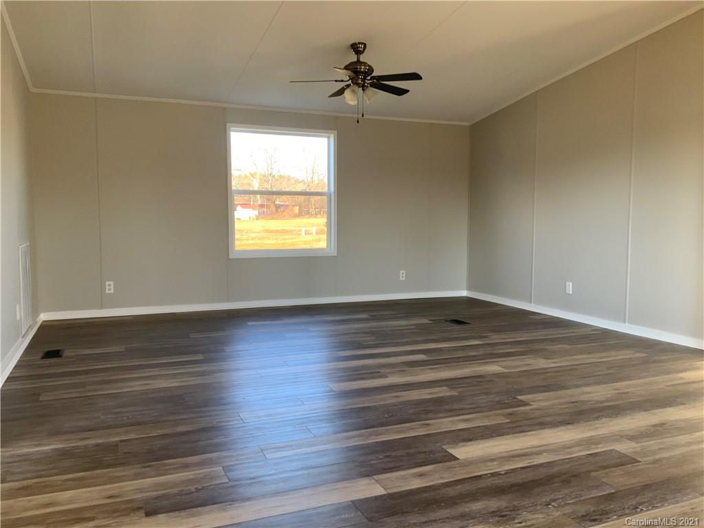 115 Riting Road, Unit 58 Salisbury, NC 28147 - Photo 6 of 23 wooden floor in an empty room with a window