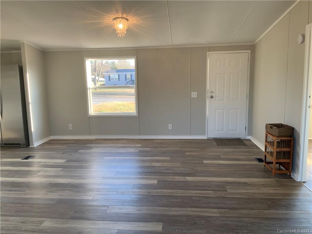 115 Riting Road, Unit 58 Salisbury, NC 28147 - Photo 7 of 23 a view of a room with wooden floor and chair