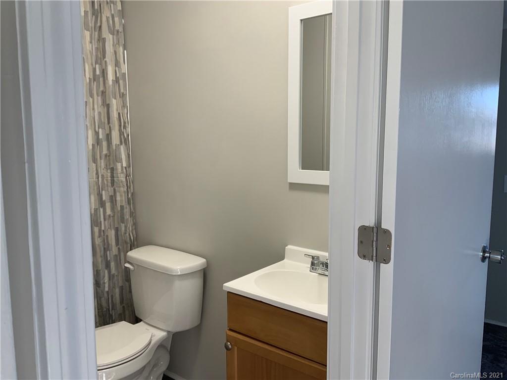 115 Riting Road, Unit 58 Salisbury, NC 28147 - Photo 9 of 23 a white toilet sitting next to a bathroom sink