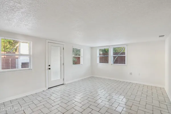 an empty room with windows