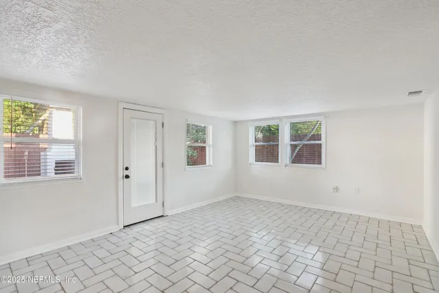 an empty room with windows