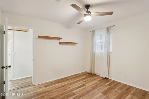 a view of a livingroom with a hardwood floor