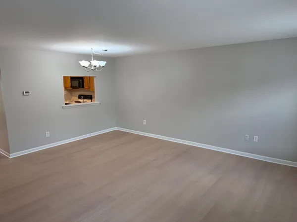 an empty room with a empty space and window