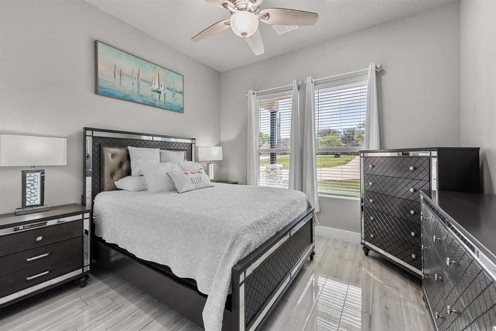 13032 Rudy's Way Streetman, TX 75859 - Photo 27 of 40 Guest bedroom with windows, ceiling fan, and flexible space for visitors or family.