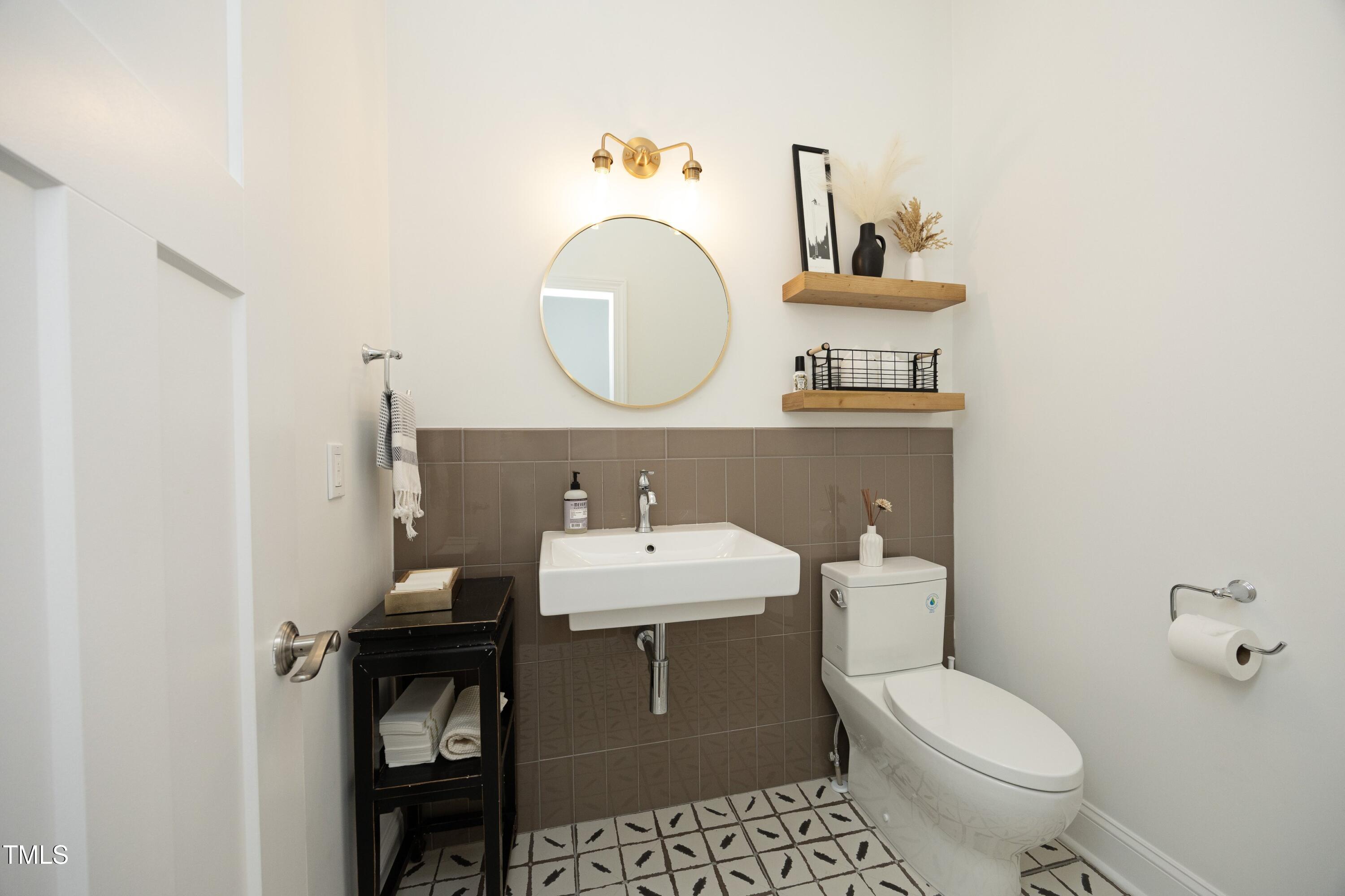 2800 Charleston Oaks Drive Raleigh, NC 27614 - Photo 20 of 53 a bathroom with a sink toilet and a mirror