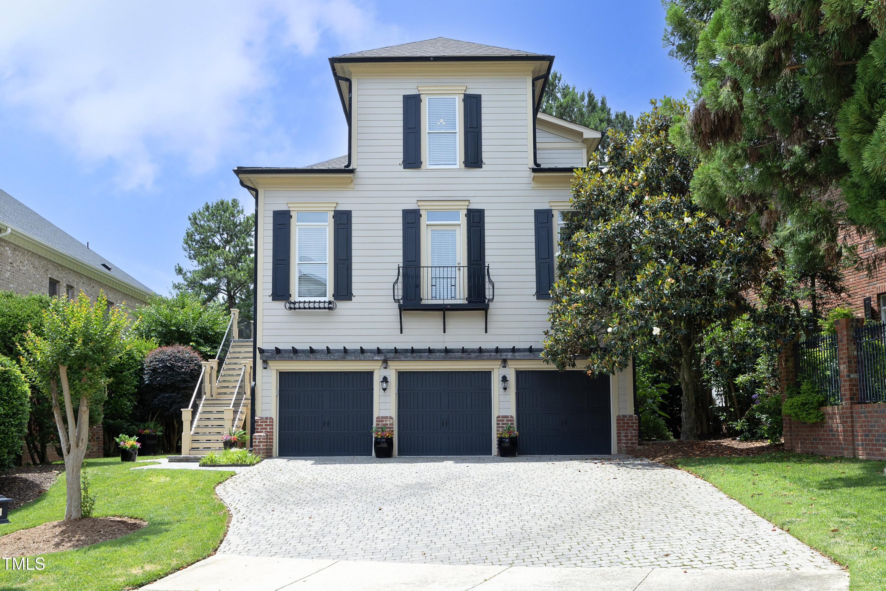 2800 Charleston Oaks Drive Raleigh, NC 27614 - Photo 2 of 53 a front view of a house with a garden and trees