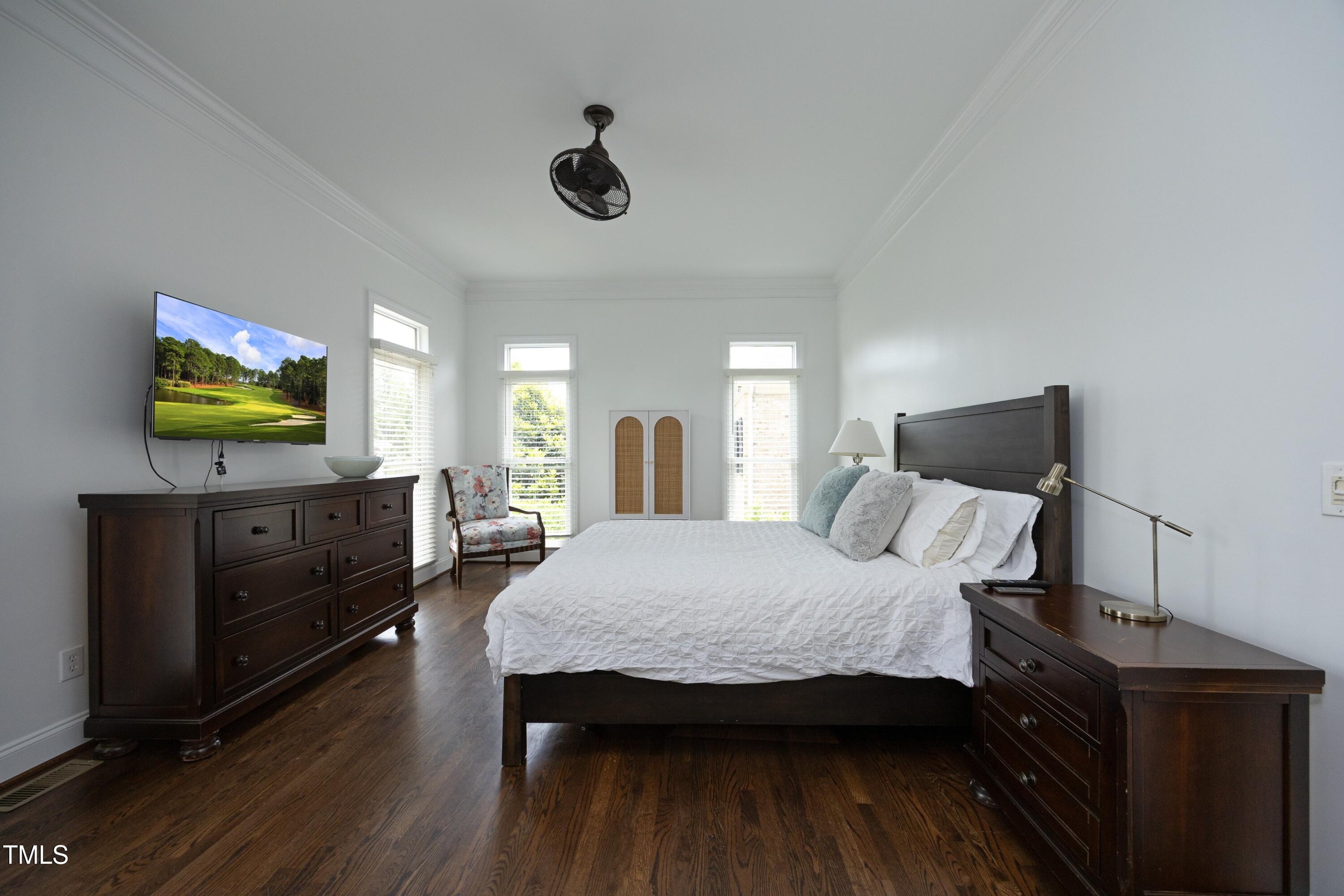 2800 Charleston Oaks Drive Raleigh, NC 27614 - Photo 21 of 53 a bedroom with furniture and a flat screen tv