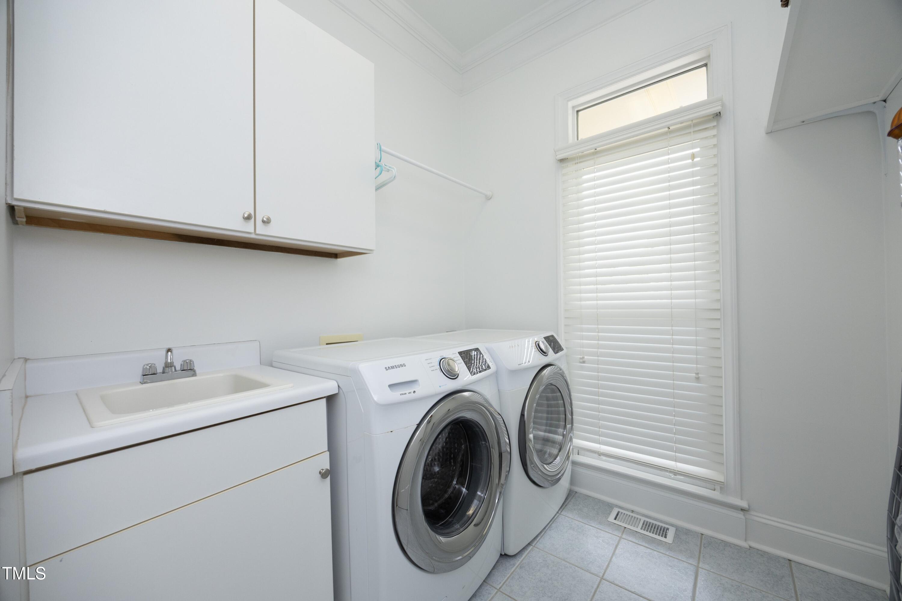 2800 Charleston Oaks Drive Raleigh, NC 27614 - Photo 23 of 53 a utility room with dryer and washer