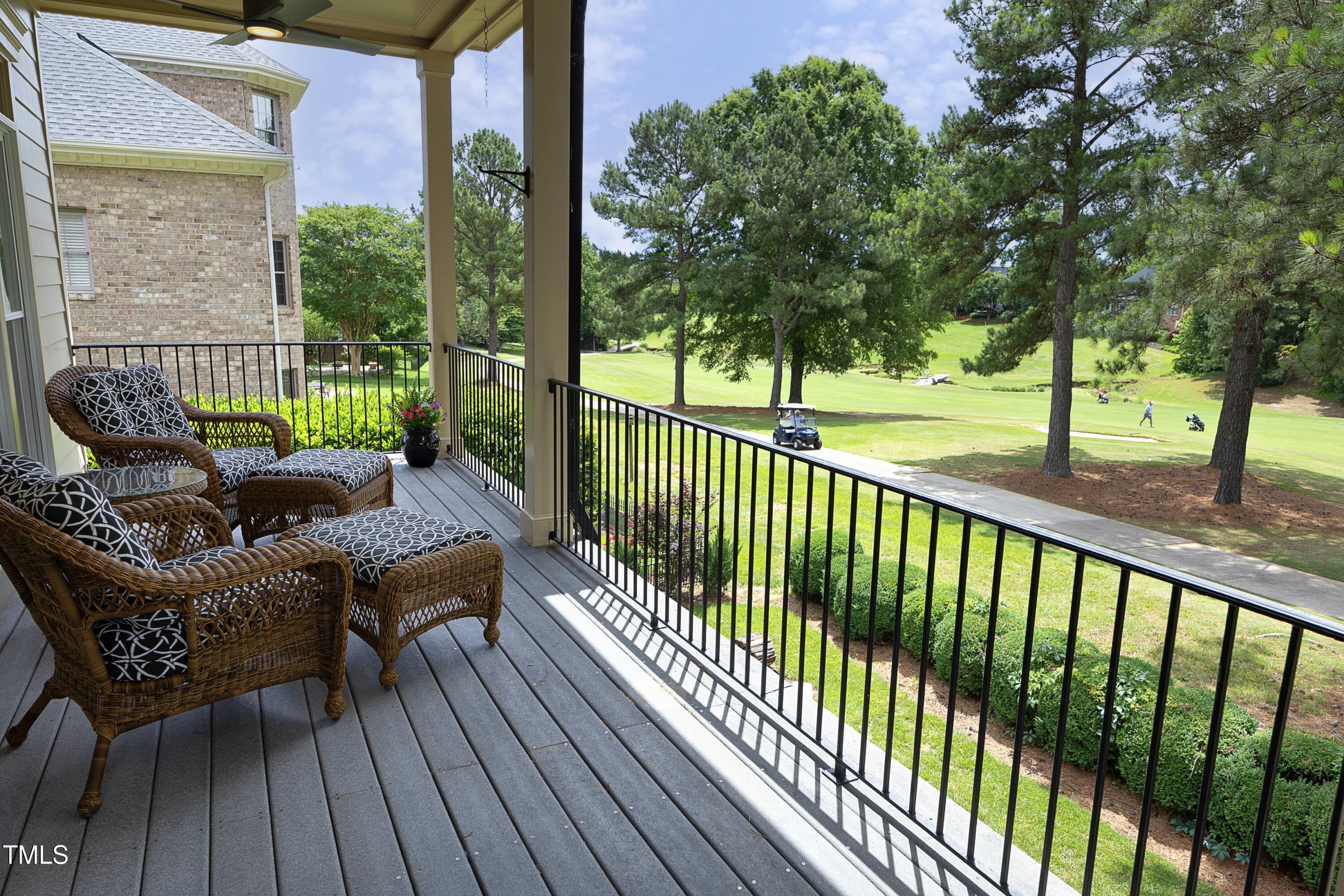 2800 Charleston Oaks Drive Raleigh, NC 27614 - Photo 26 of 53 a view of a balcony with wooden floor and outdoor seating