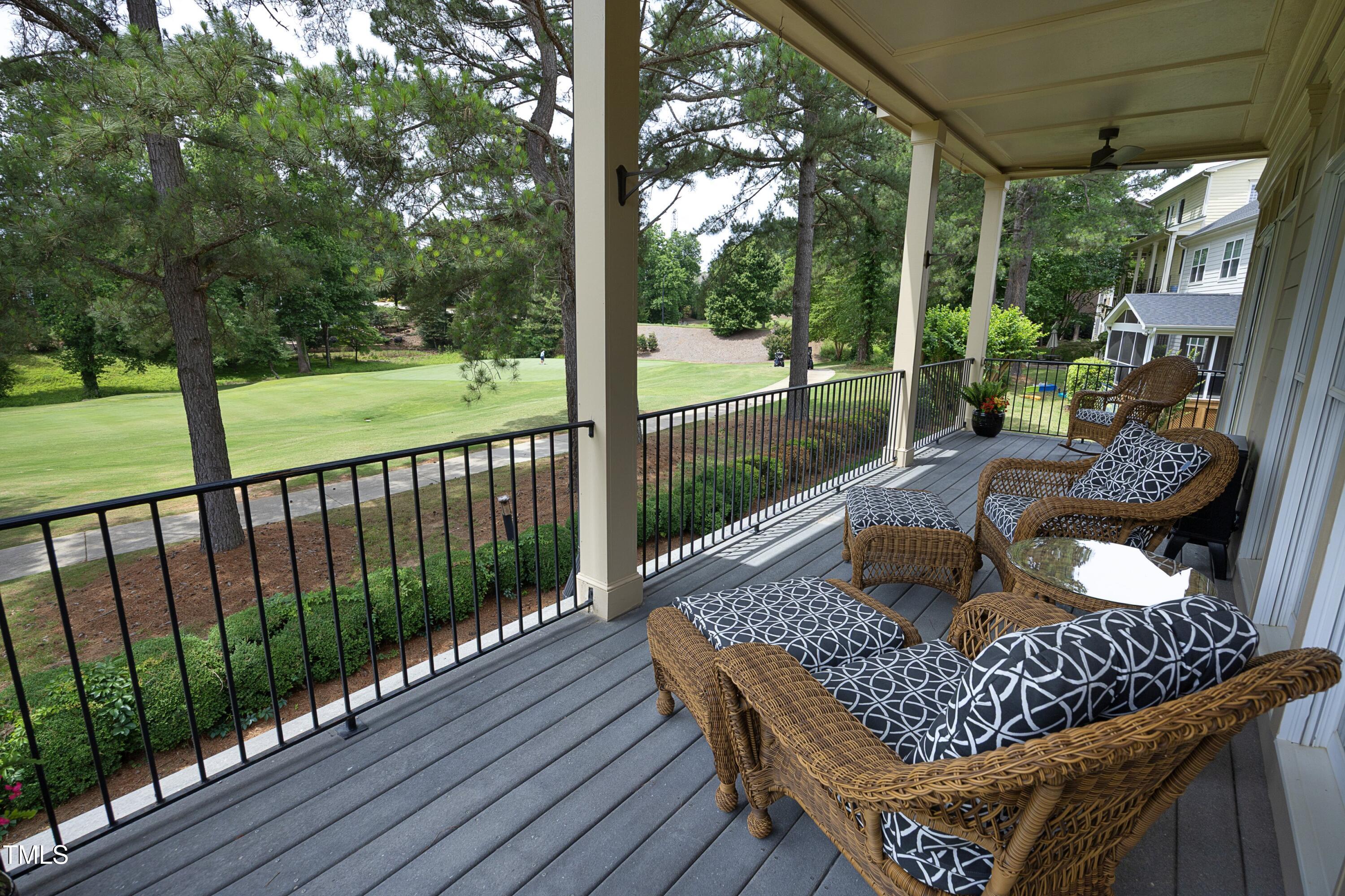2800 Charleston Oaks Drive Raleigh, NC 27614 - Photo 27 of 53 a view of a deck with a table and chairs