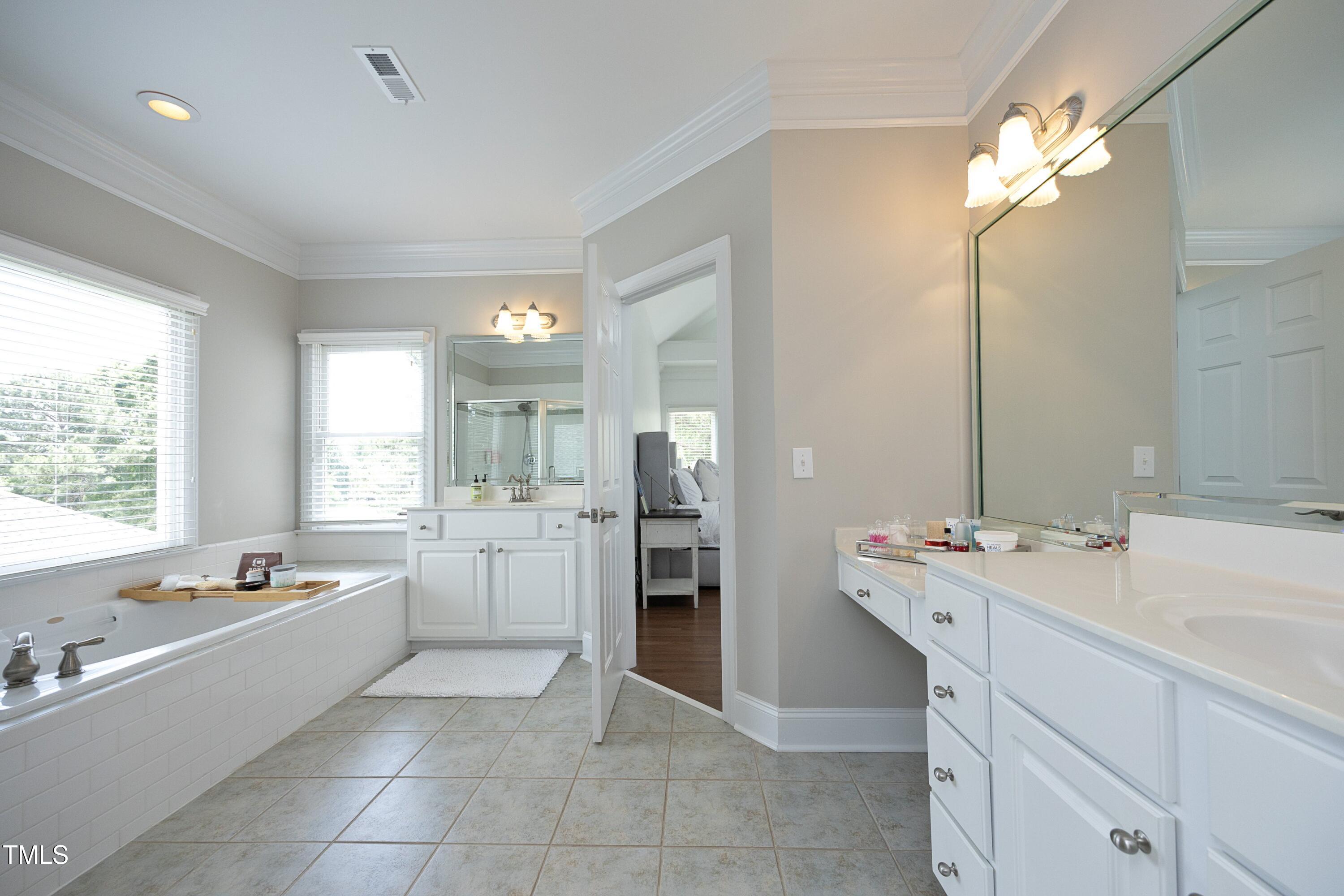 2800 Charleston Oaks Drive Raleigh, NC 27614 - Photo 35 of 53 a large kitchen with a sink and cabinets