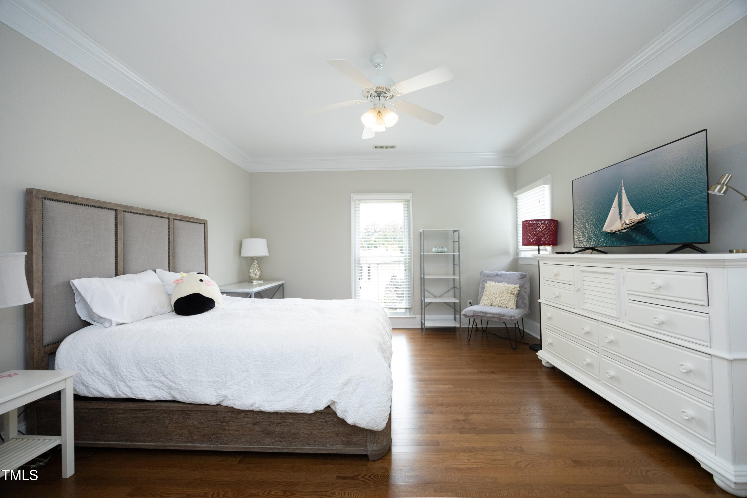 2800 Charleston Oaks Drive Raleigh, NC 27614 - Photo 36 of 53 a bedroom with a large bed and a large window