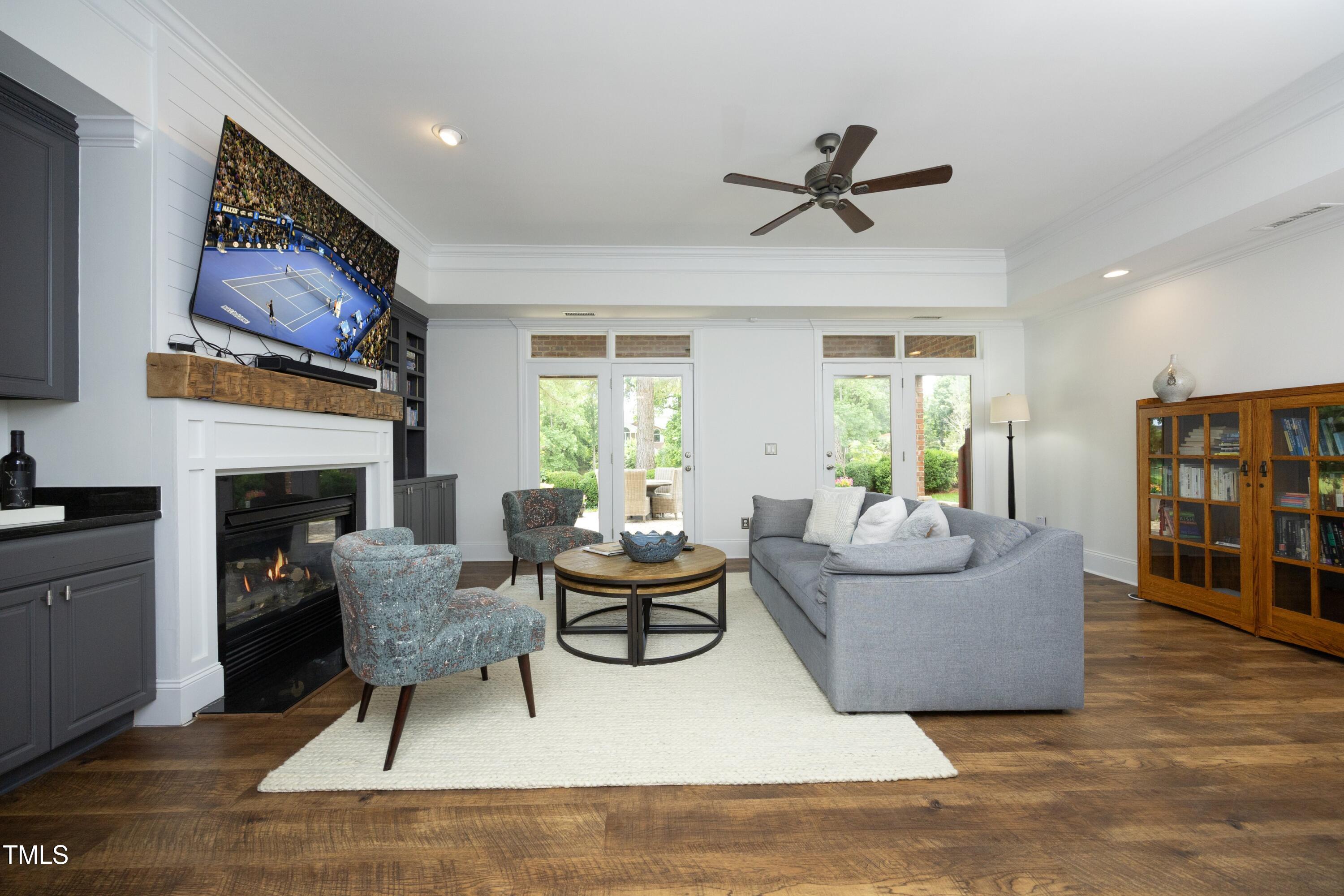 2800 Charleston Oaks Drive Raleigh, NC 27614 - Photo 39 of 53 a living room with furniture a fireplace and a flat screen tv