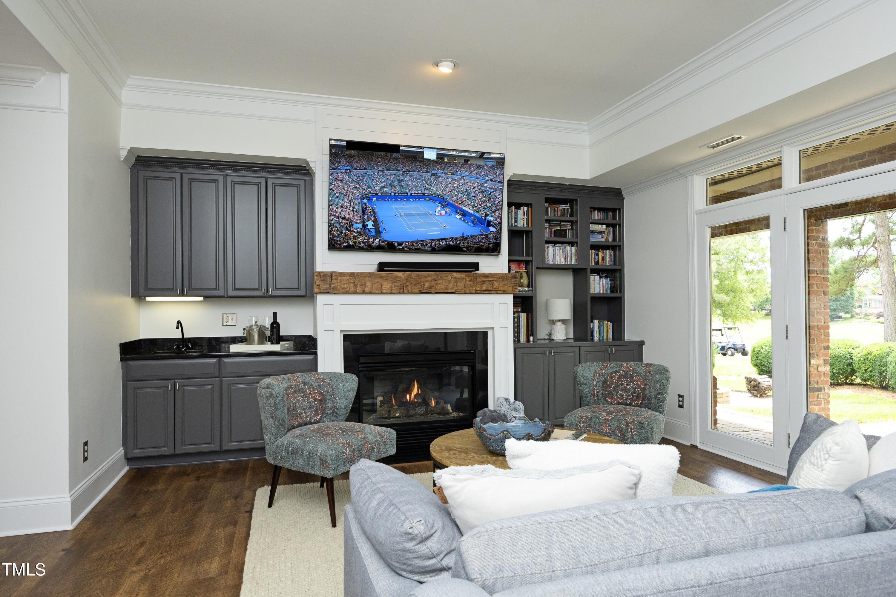 2800 Charleston Oaks Drive Raleigh, NC 27614 - Photo 40 of 53 a living room with furniture and a fireplace