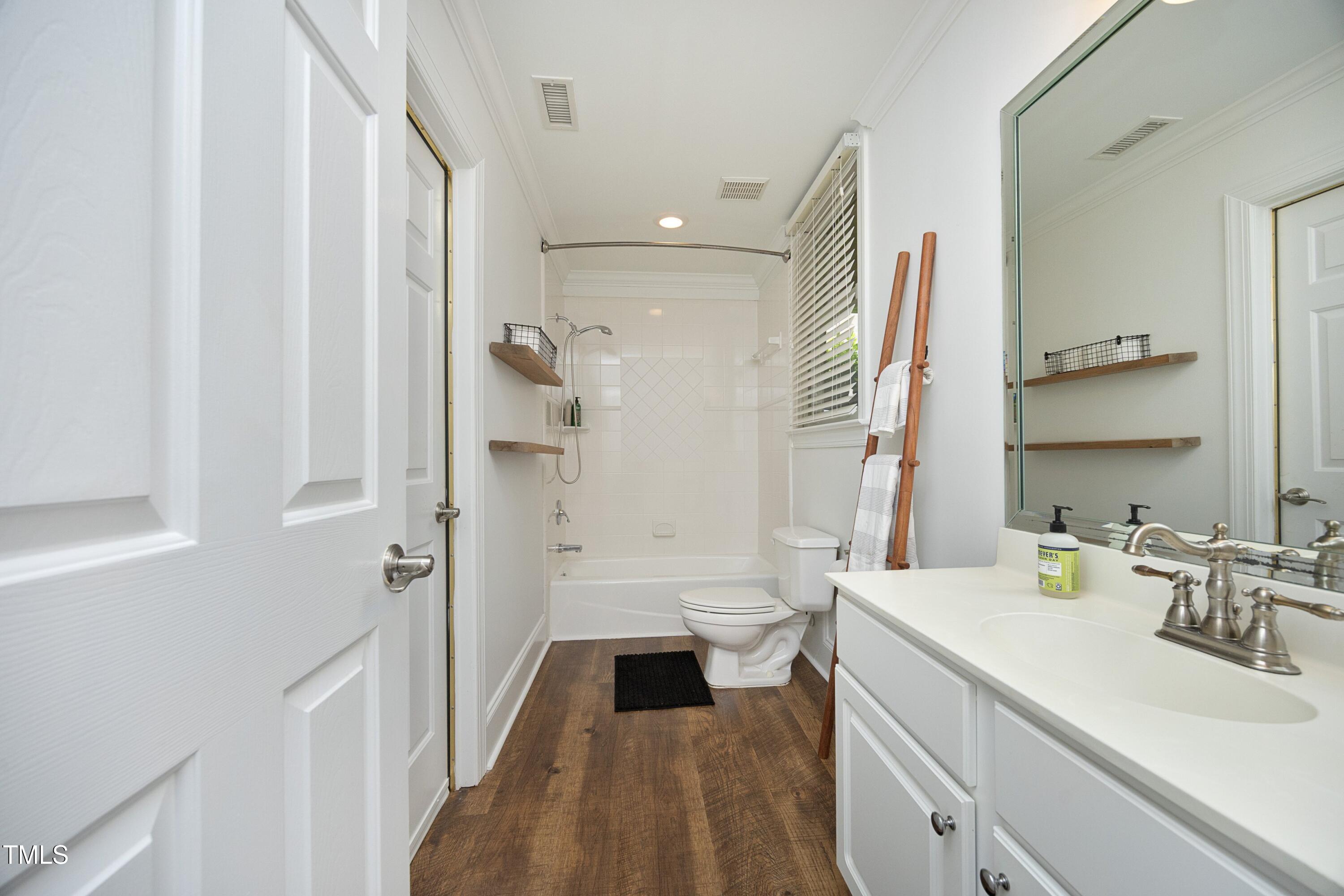 2800 Charleston Oaks Drive Raleigh, NC 27614 - Photo 43 of 53 a bathroom with a sink a toilet and shower