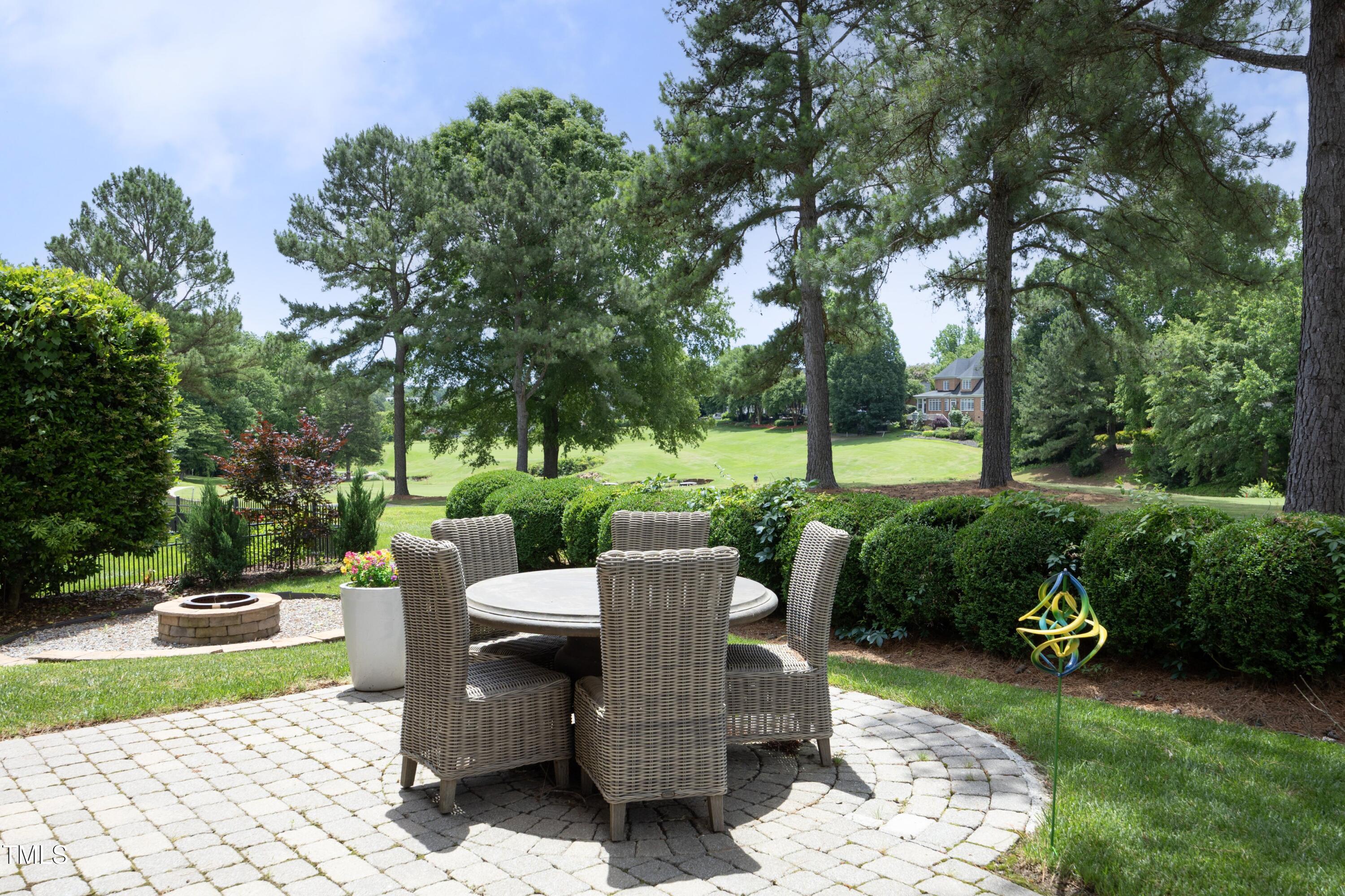 2800 Charleston Oaks Drive Raleigh, NC 27614 - Photo 47 of 53 a view of a table and chairs in the garden